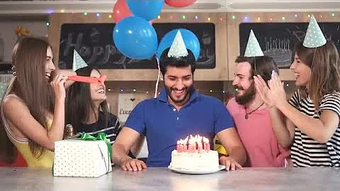 Man Blows Birthday Candles Stock Video