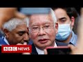 Former Malaysia PM jailed in financial scandal - BBC News