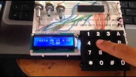sensor de temperatura suma y resta de entrada de voltajes pic 16f877a lcd.teclado,sensor