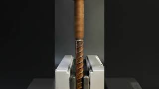 Rusted Rebar Secured Firmly in Heavy-Duty Vise