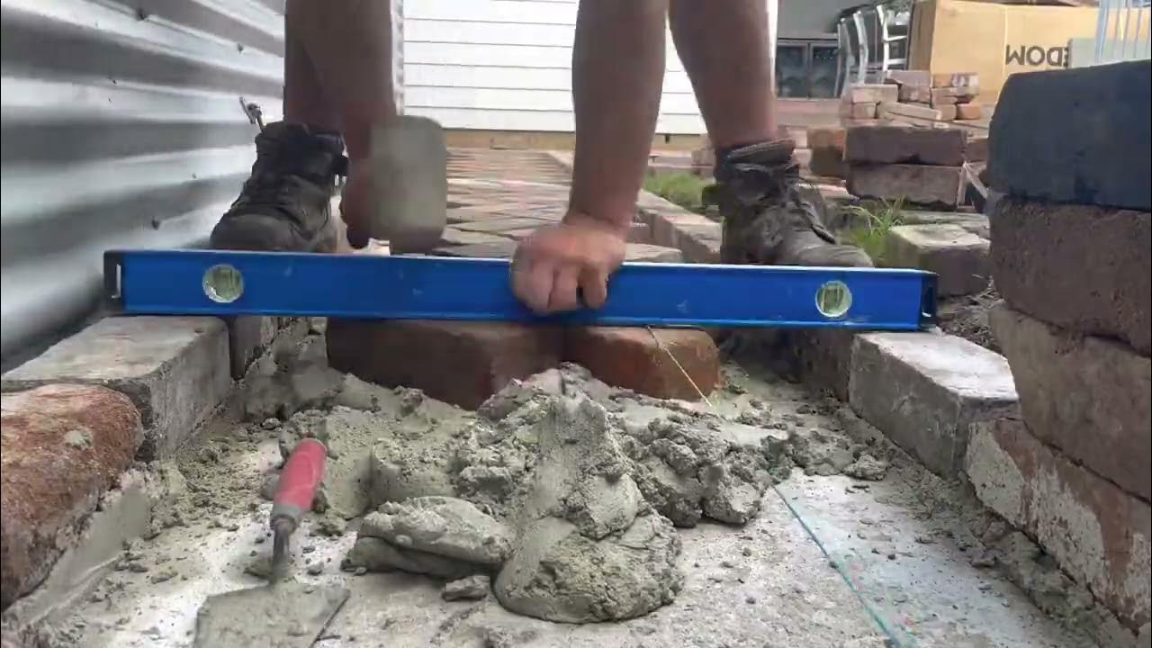 Recycled brick path in a 45 degree herringbone pattern with mortar