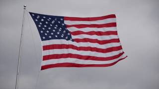 American flag flaps during heavy wind storm