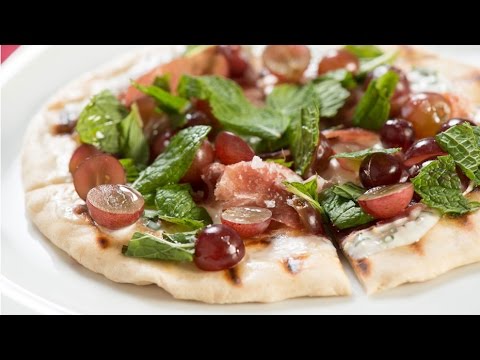 Flatbread with Red Grapes, Prosciutto, Crème Fraîche, Mint, and Olive Oil