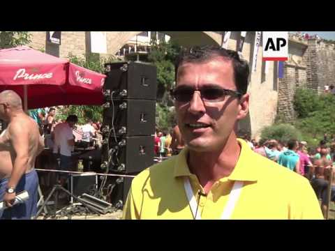 Traditional High Diving Event From Bridge Resumes 