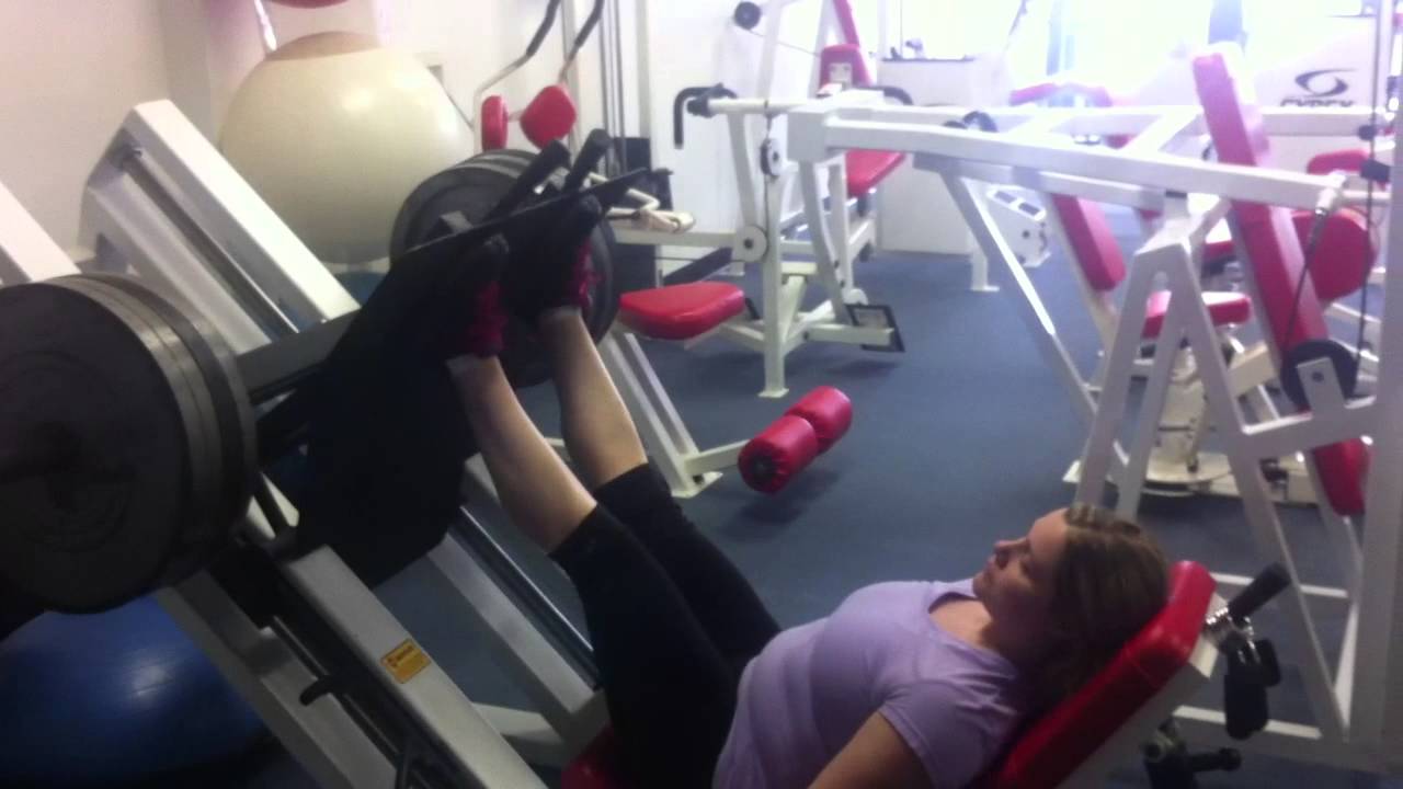 Client at Total Training Fitness attempting 450 lbs. on leg press