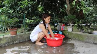 Beautiful Single Mom Washing Clothes On Weekends
