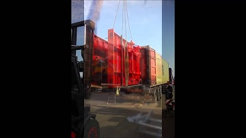 Loading MAC Bale Trailer into a large container carrier
