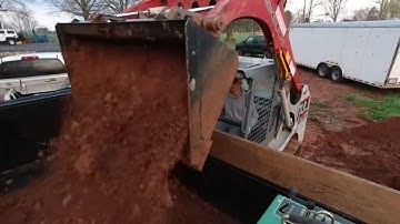Loading dirt with Takeuchi TL8 skid steer