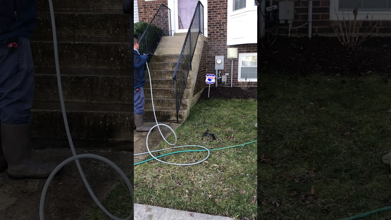 Pressure washing concrete stairs