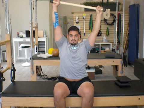 upright sitting active assisted arm flexion with scapular upward rotation_arm and trunk circles