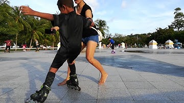 A small child 2 years old playing rollerblades  oak-oom kids show