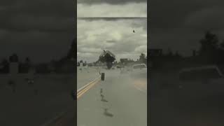 Car airborne from loose wheel