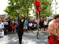 Three funny acrobats street performers dangerous stunts 10 feet unicycle juggler