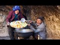 Old style cooking in the cave like 2000 years ago  old lovers cooking vegetarian food in the cave