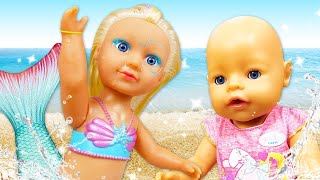 Baby Annabell doll &amp; the mermaid doll. Baby born doll at the beach. Dolls videos for kids.