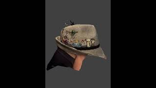 Oktoberfest hat with 10 years of pins.