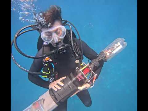 Scripps Oceanography graduate student with Tiny Directional Acoustic Logger (TiDAL)