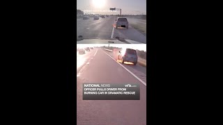 Officer pulls driver from burning car in dramatic rescue