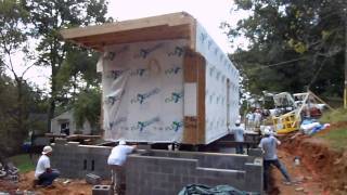 A New Norris House: Unit one is shifted into place