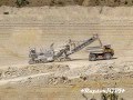 Wirtgen surface miner loads limestone on BELAZ. Добыча известняка карьерным комбайном Wirtgen