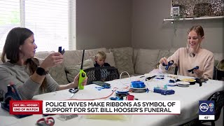 Police wives make ribbons as symbol of support for Sgt. Bill Hooser&#39;s funeral