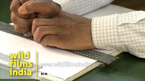 Use of braille slate and stylus by visually challenged man for writing, Dehradun