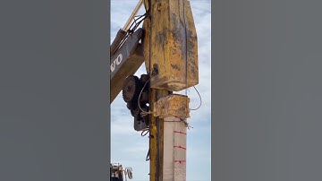 The process of inserting concrete poles into the ground. #shorts