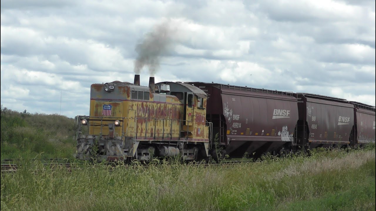 Two BNSF/TPW empty grain trains plus elevator switcher