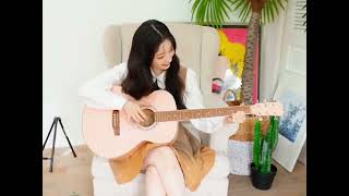Dahyun playing the guitar