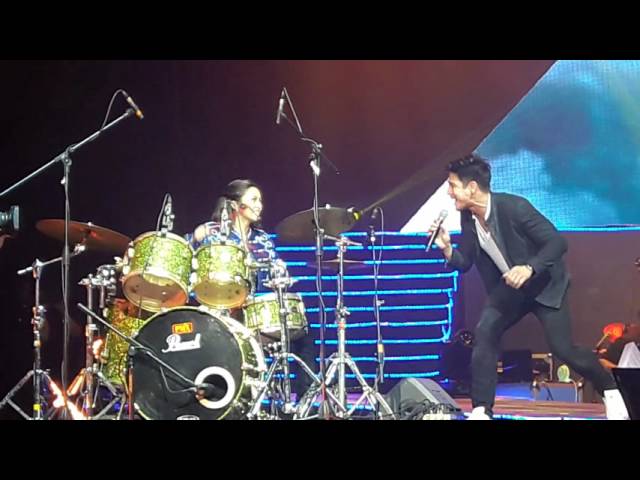 Kim Chiu take on drums while Piolo Pascual sings.. class=