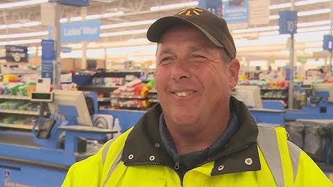 Walmart employee pushes equal amounts of carts and kindness