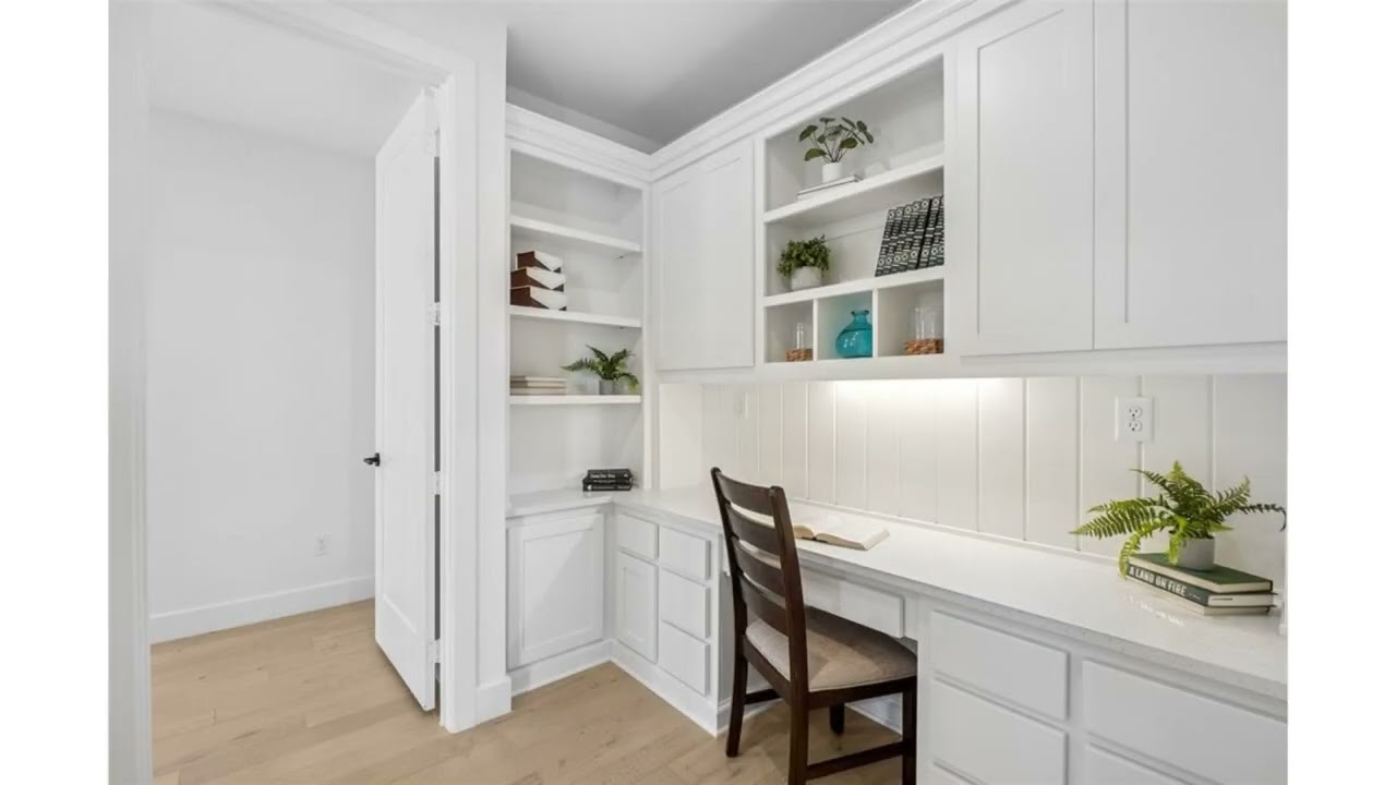 Designed with intention and filled with light, this beautifully curated corner-lot home in Mustang