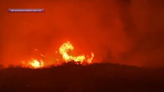 Crews battle wind-whipped California brushfire