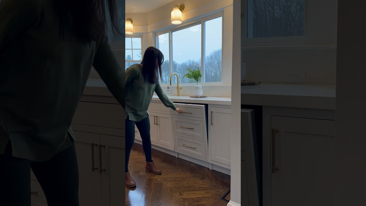 A seamless and sleek hidden dishwasher disguised as cabinets in our clients new kitchen.