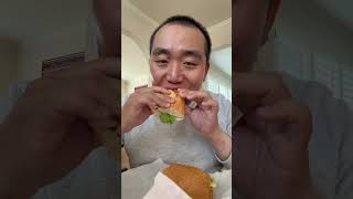 Showing and eating Combination Pork Sandwich from Que Huong Vietnamese Deli