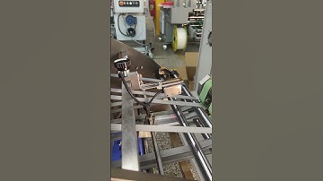 Leaflet folding machine with Vertical Stacker