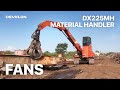 Dx225mh moving mountains with develon material handler