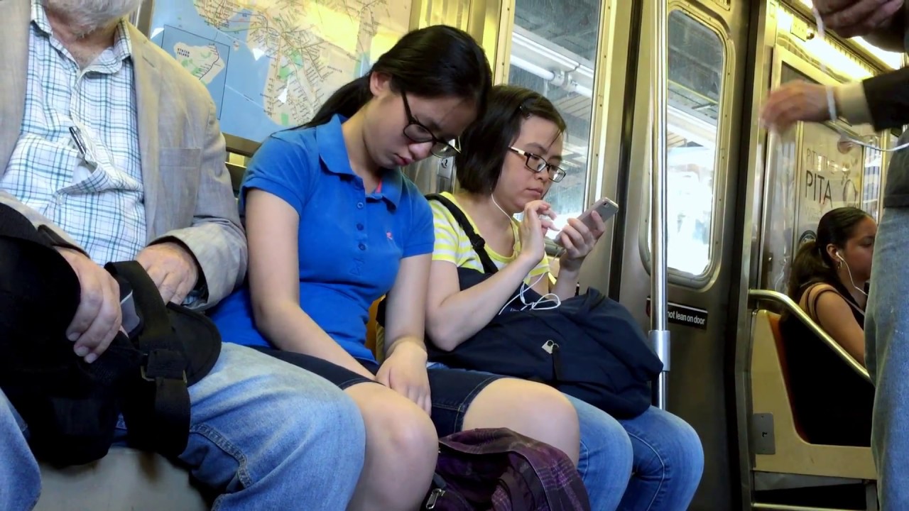 Chinese girl nodding in and out on D Train, NYC