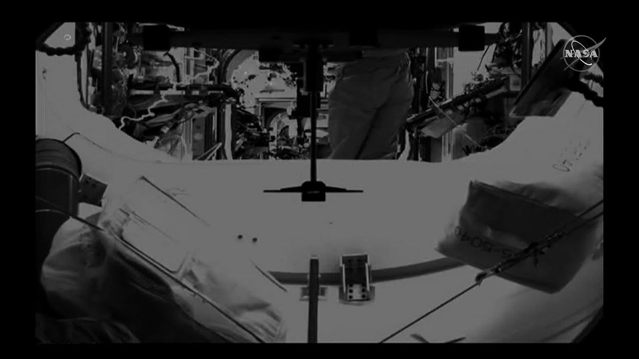 Dragon capsule crew members enter space station