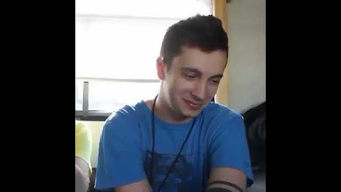 Tyler Joseph biting his arm