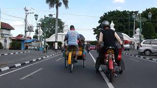 Javanese rickshaw called Becak going to Kraton