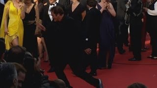 Quentin Tarantino dances on the red carpet, as the cast of Pulp Fiction reunites in Cannes