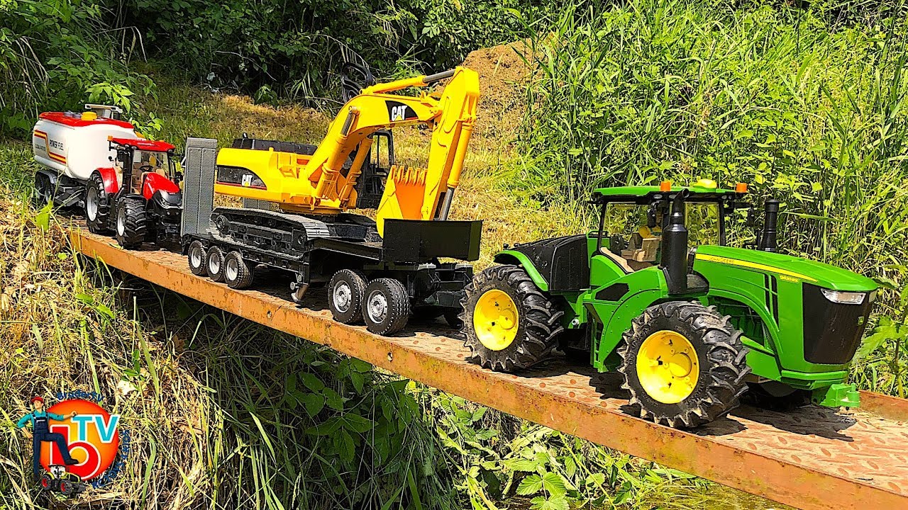 BRUDER TRAKTOR RC John DEERE pulls Big EXCAVATOR Cat YouTube