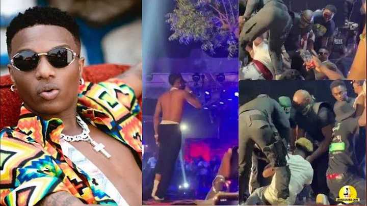 BREAKING! WIZKID FALL ON STAGE YET AGAIN DURING HIS PERFORMANCE AS FANS DRAGS HIS SHOES AND CLOTHES