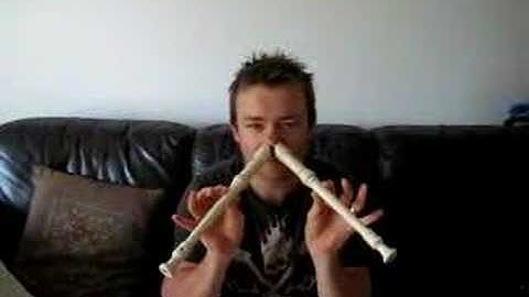 Guy plays 2 Recorders at once!!!