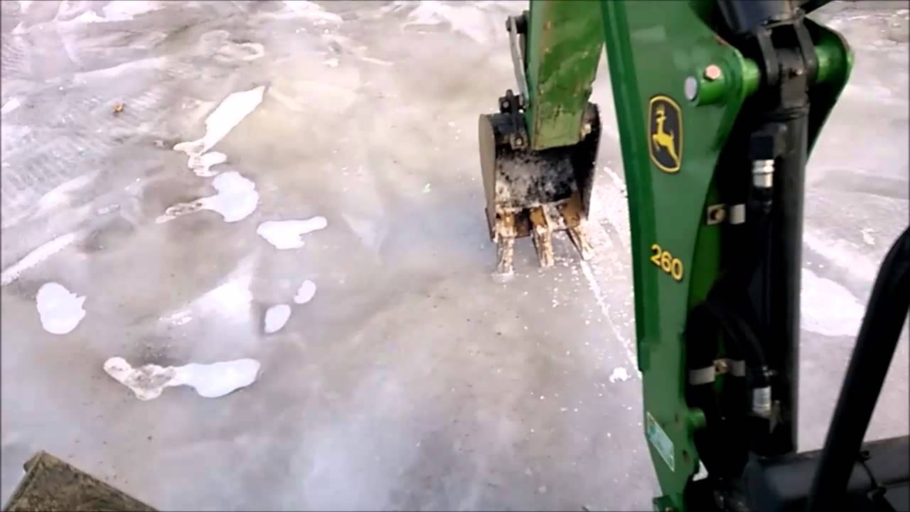 Backhoe on Ice! - YouTube