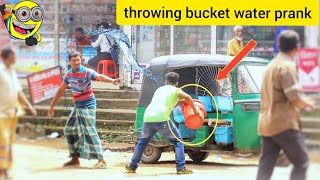 Throwing Fake Water With Buckets Is Prank On public | Fake Water Throwing Prank On Public Reaction 😂