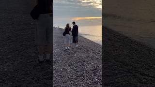 #Cloudyday , #couple , #sunset , #evening glow, #beach , #waves .