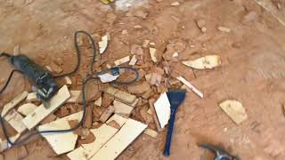 Removing underlayment flooring to expose the subfloor
