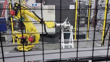 Keyence RB 3D vision at load, CNC load-unload with a Fanuc robot, exit end RP dunk, and palletize.